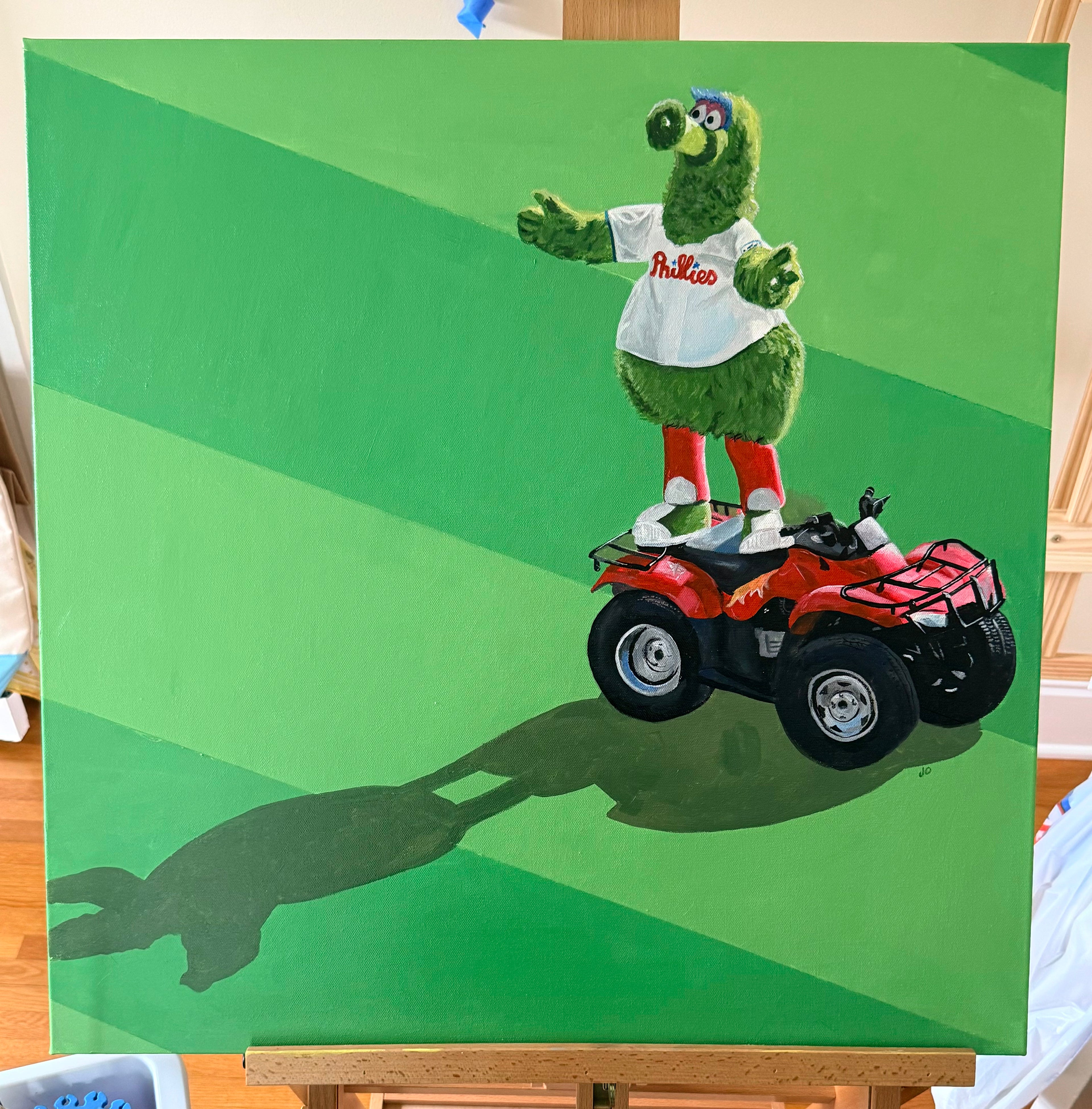 Green mascot character on a red ATV against a green background